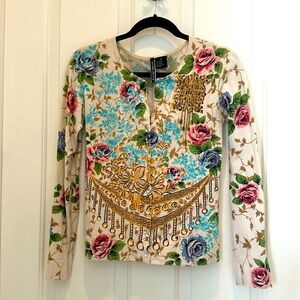 Boutique floral sweater sparkling crystal buttons.